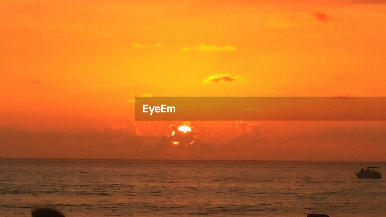 SCENIC VIEW OF SEA DURING SUNSET