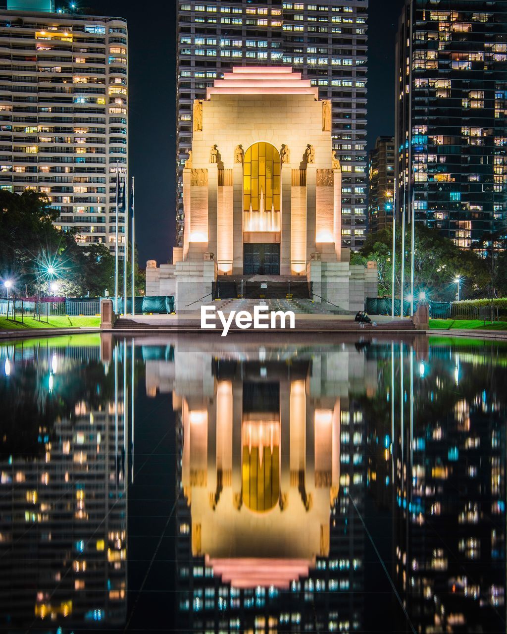 Reflection of buildings in city at night