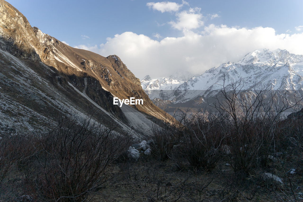 Scenic view of snowcapped mountains against sky