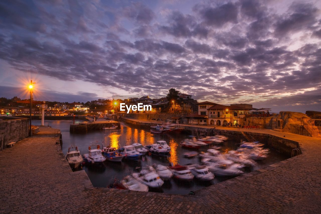 ILLUMINATED BUILDINGS AT WATERFRONT