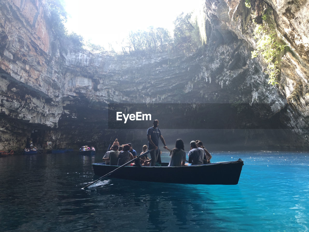 PEOPLE IN BOAT ON WATER