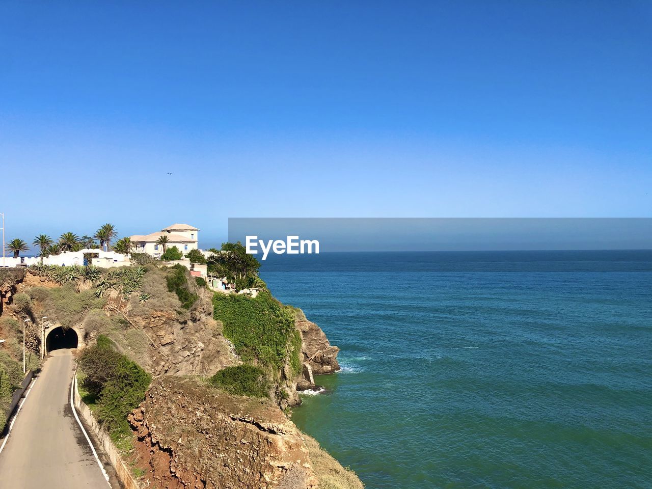 Scenic view of sea against clear blue sky