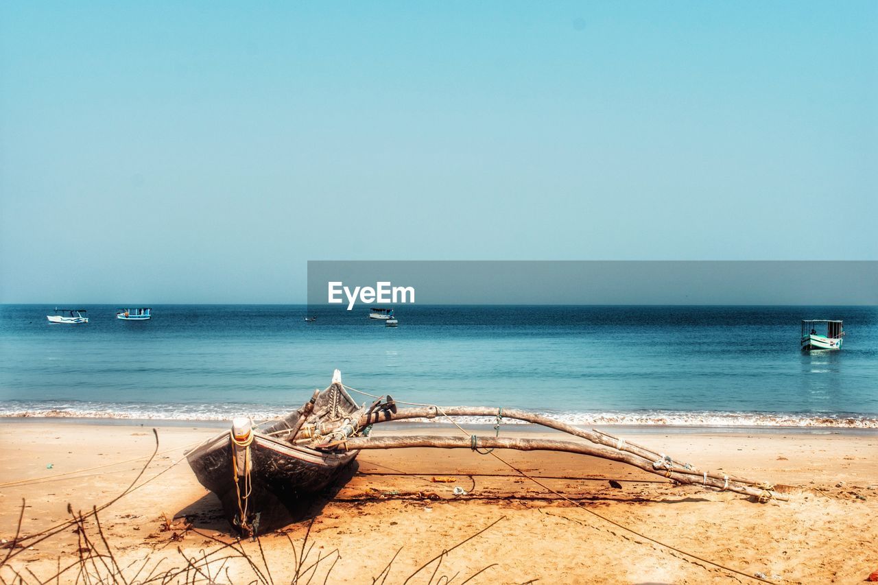 Scenic view of beach against clear sky