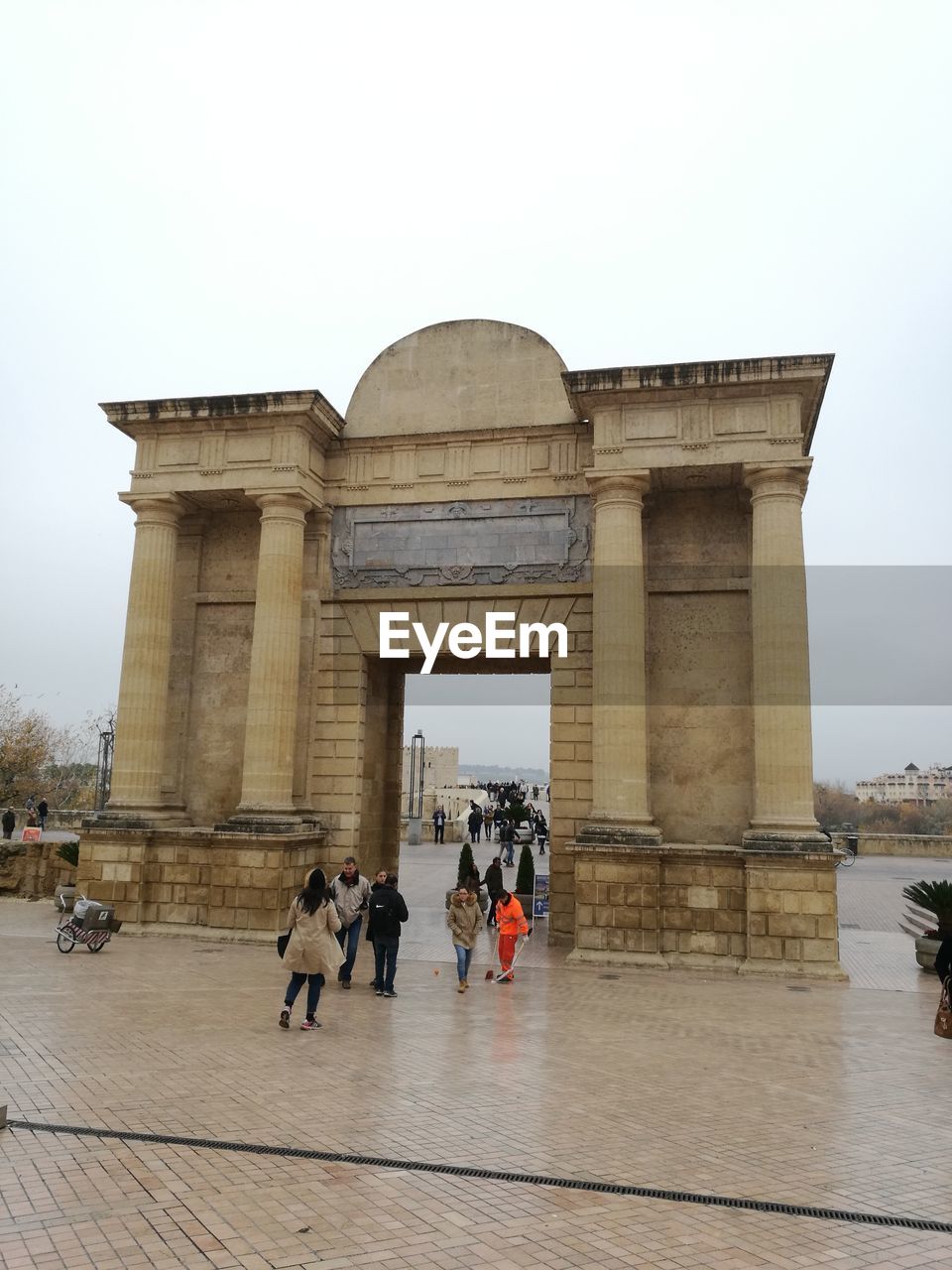 PEOPLE AT MONUMENT AGAINST SKY