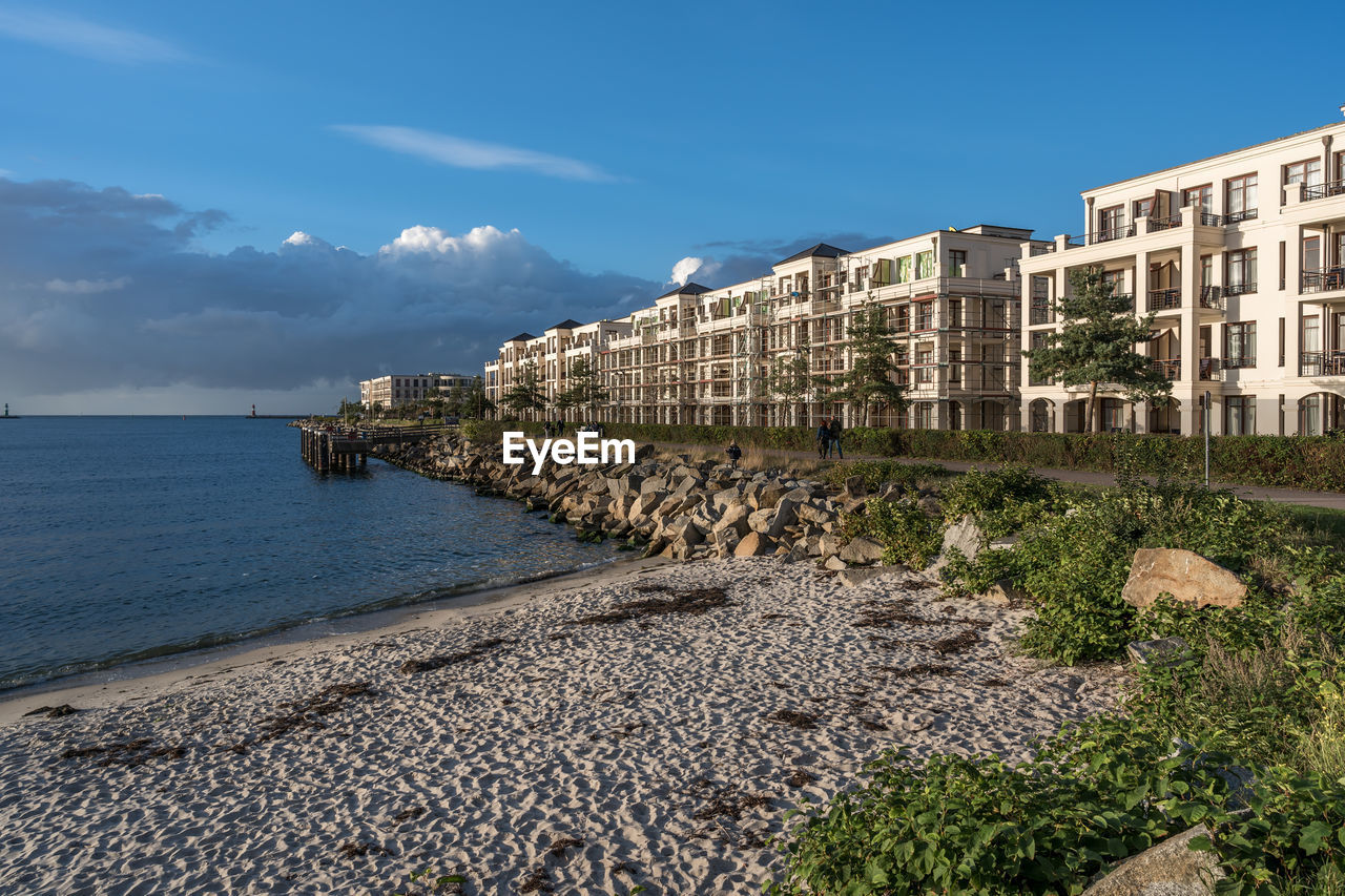 SCENIC VIEW OF SEA BY BUILDING AGAINST SKY