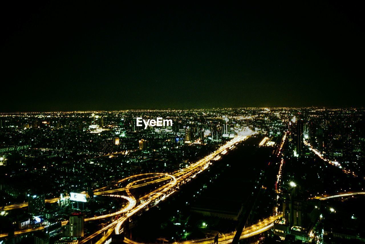 ILLUMINATED CITYSCAPE AT NIGHT