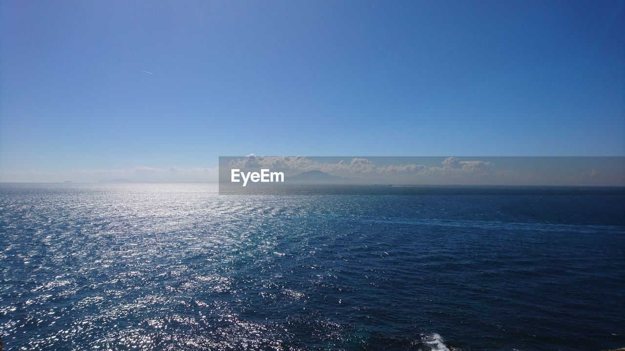 SCENIC VIEW OF BLUE SEA AGAINST CLEAR SKY