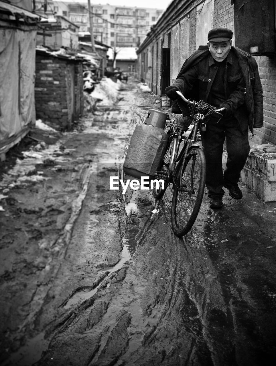 MAN CYCLING ON STREET