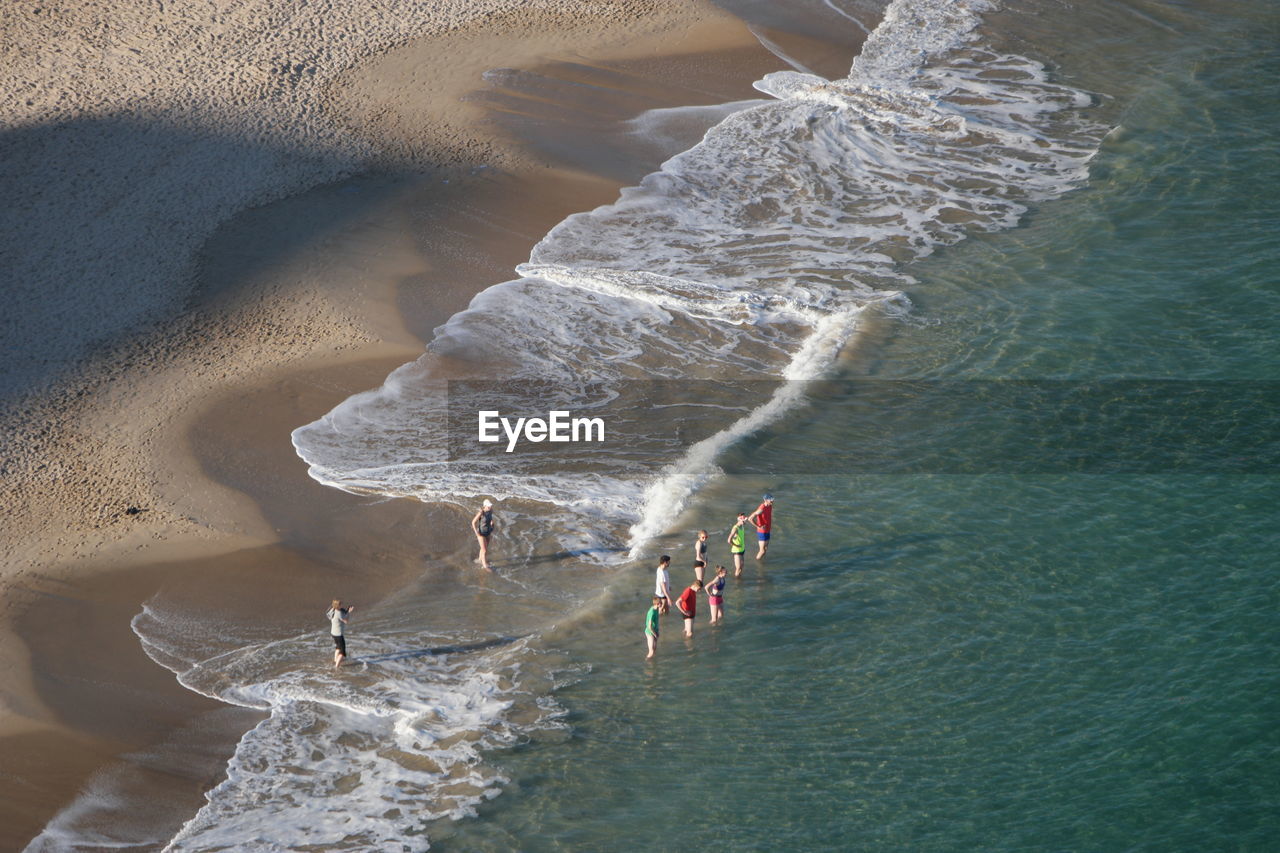 High angle view of people on shore at beach