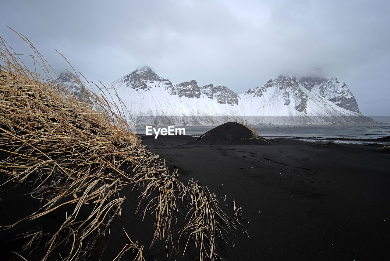 Scenic view of snowcapped mountains against sky