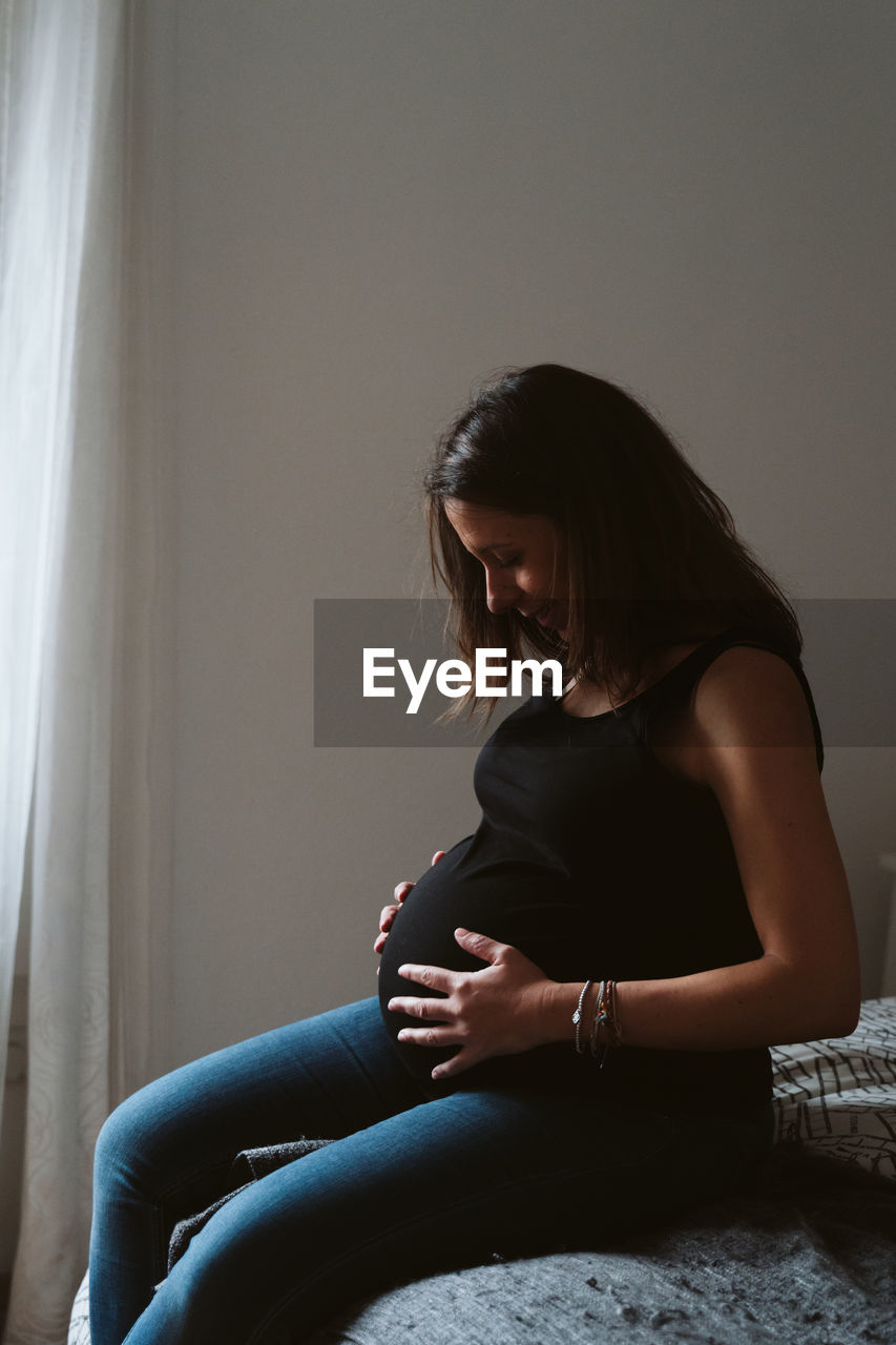 Pregnant woman resting at home