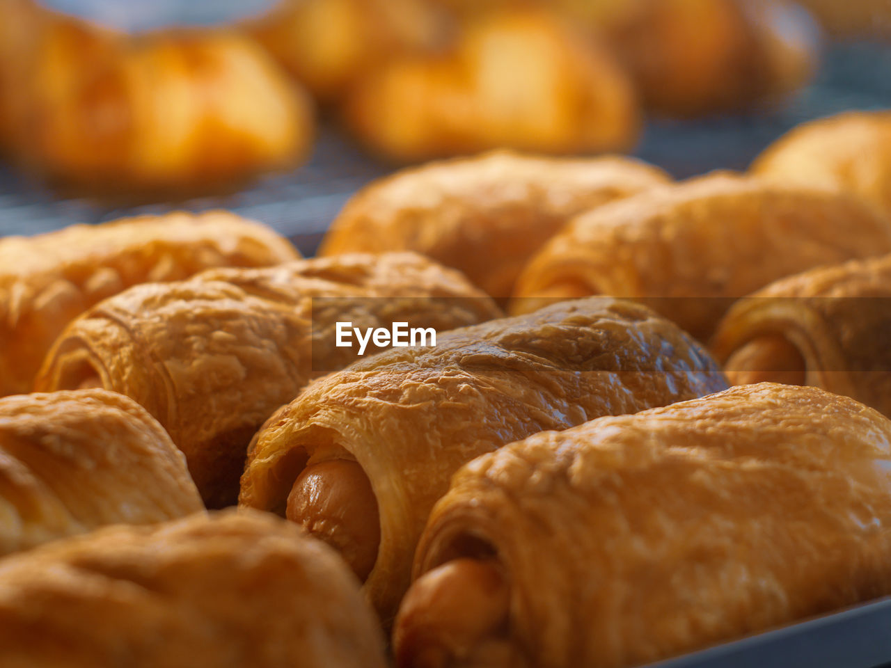 Close-up of croissants in bakery for sale