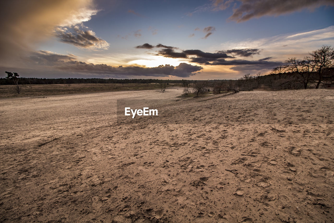 Scenic view of landscape against sky during sunset