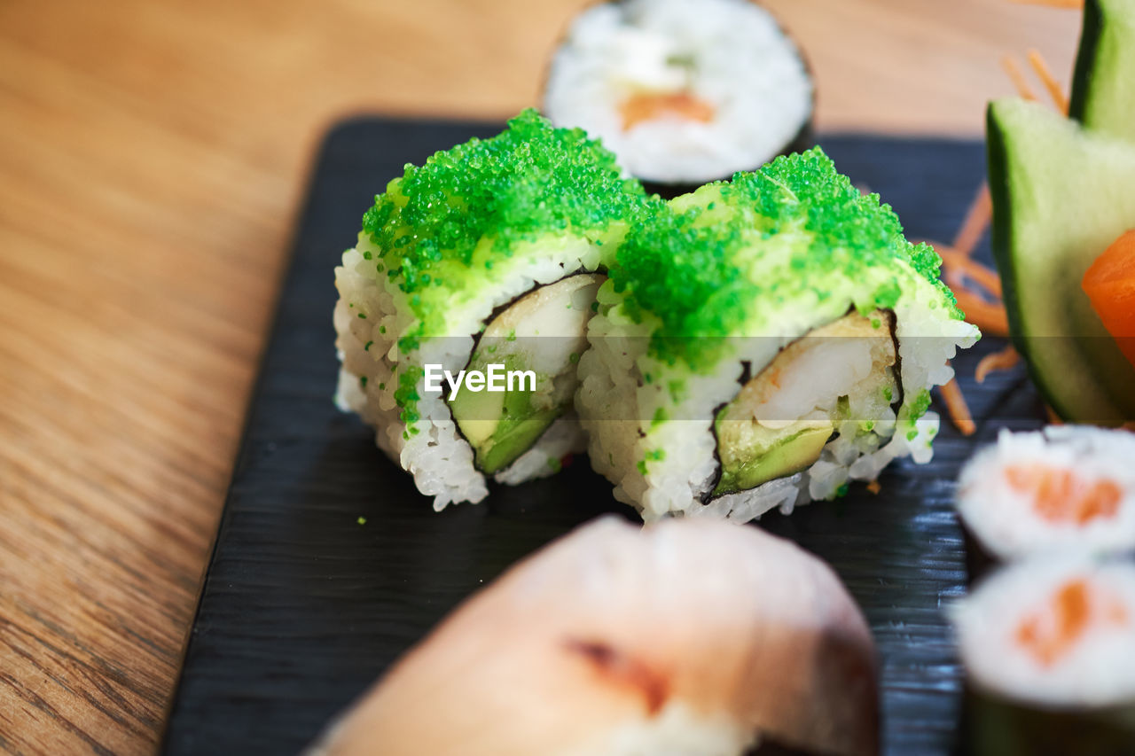 CLOSE-UP OF SUSHI IN PLATE