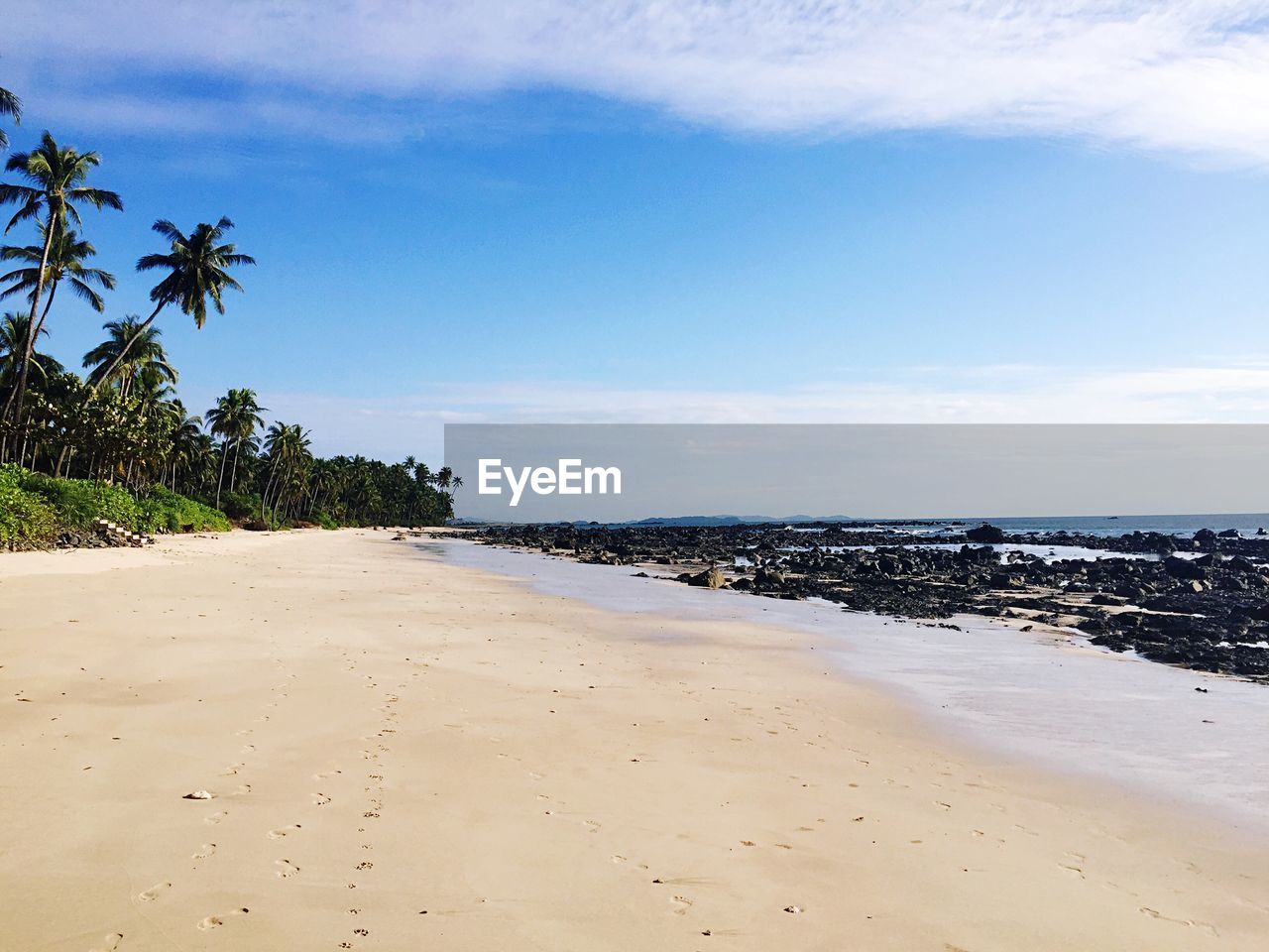 Scenic view of beach against sky