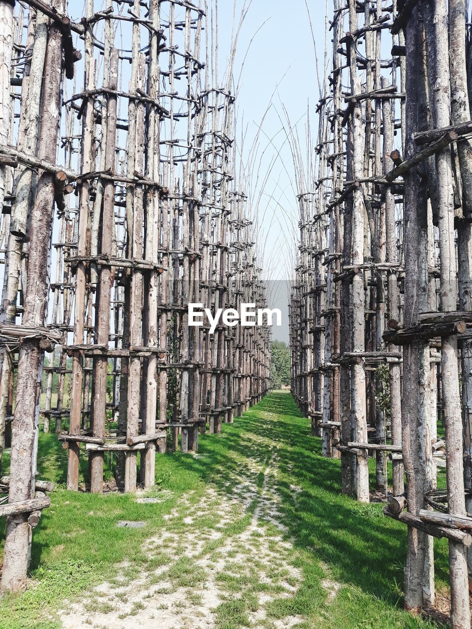 Wooden built structure on field against sky