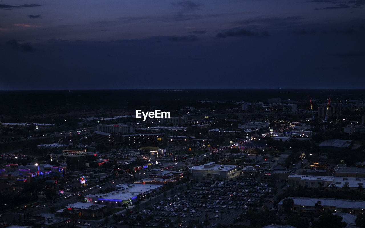 Aerial view of illuminated cityscape at night