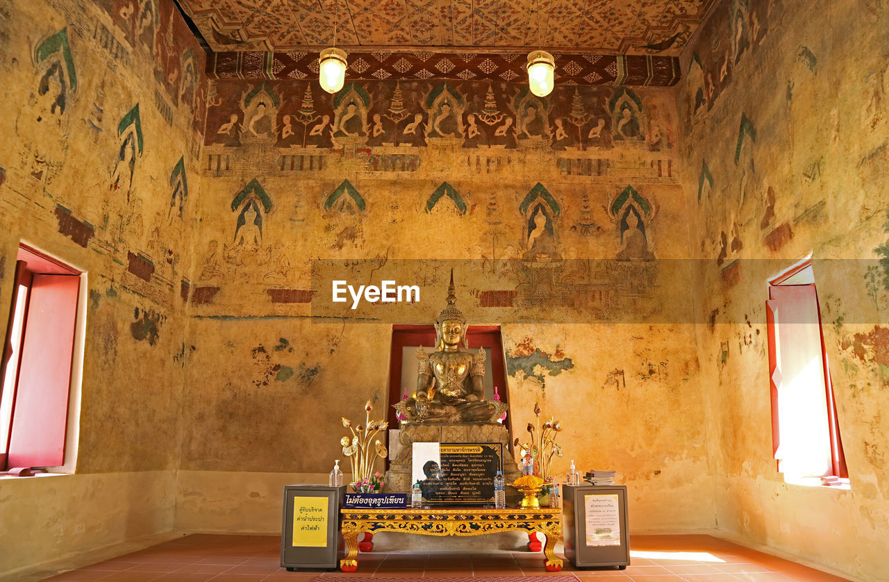 Interior of the old vihara of wat chomphuwek buddhist temple, national ancient monument in thailand