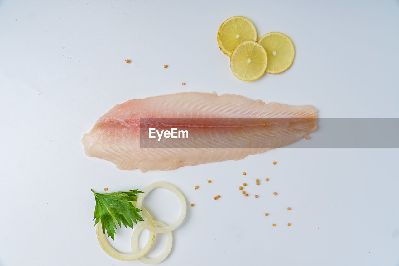 Fresh fillet dory on a white background