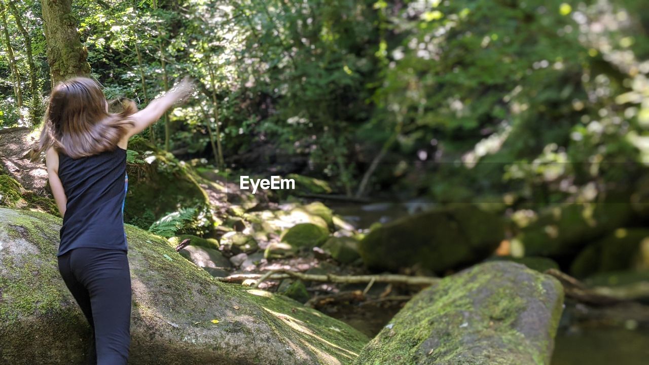 Throwing rocks in river