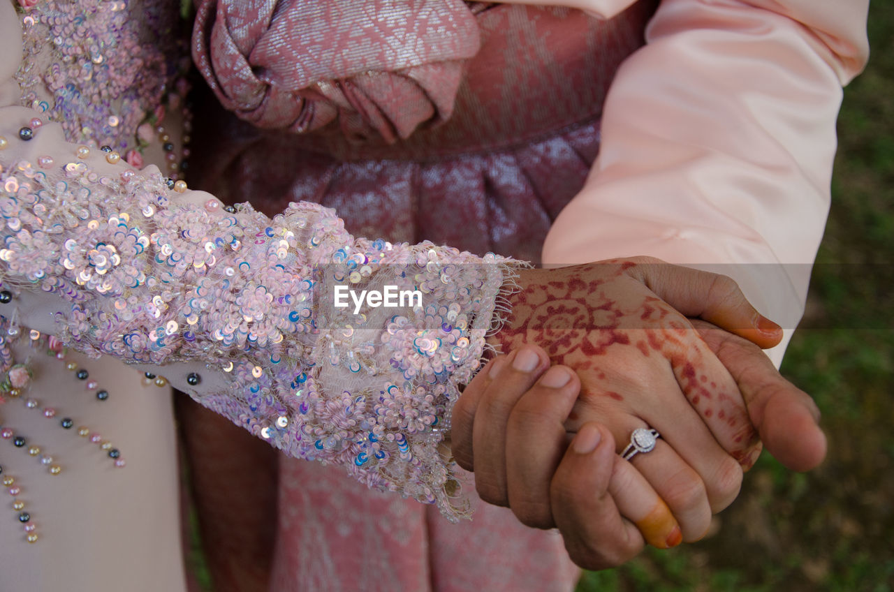 High angle view of woman hands clasped