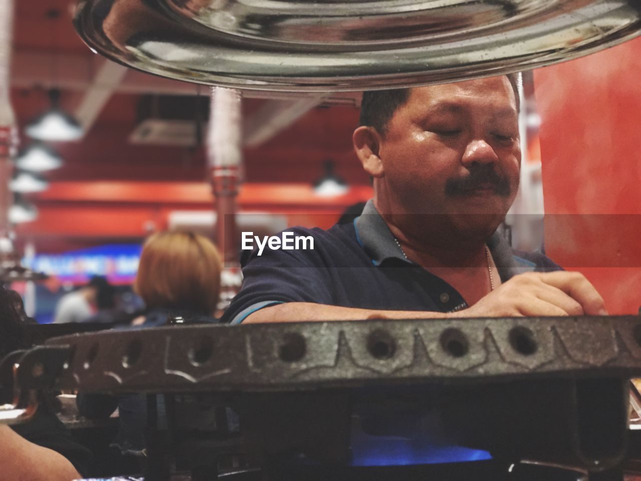 Low angle view of man cooking food