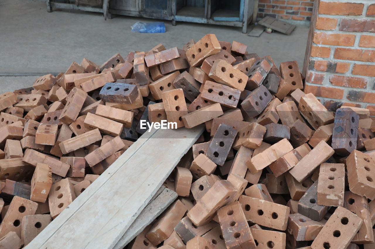 wood, large group of objects, brick, abundance, wall, no people, iron, high angle view, industry, timber, art, heap, day, brickwork