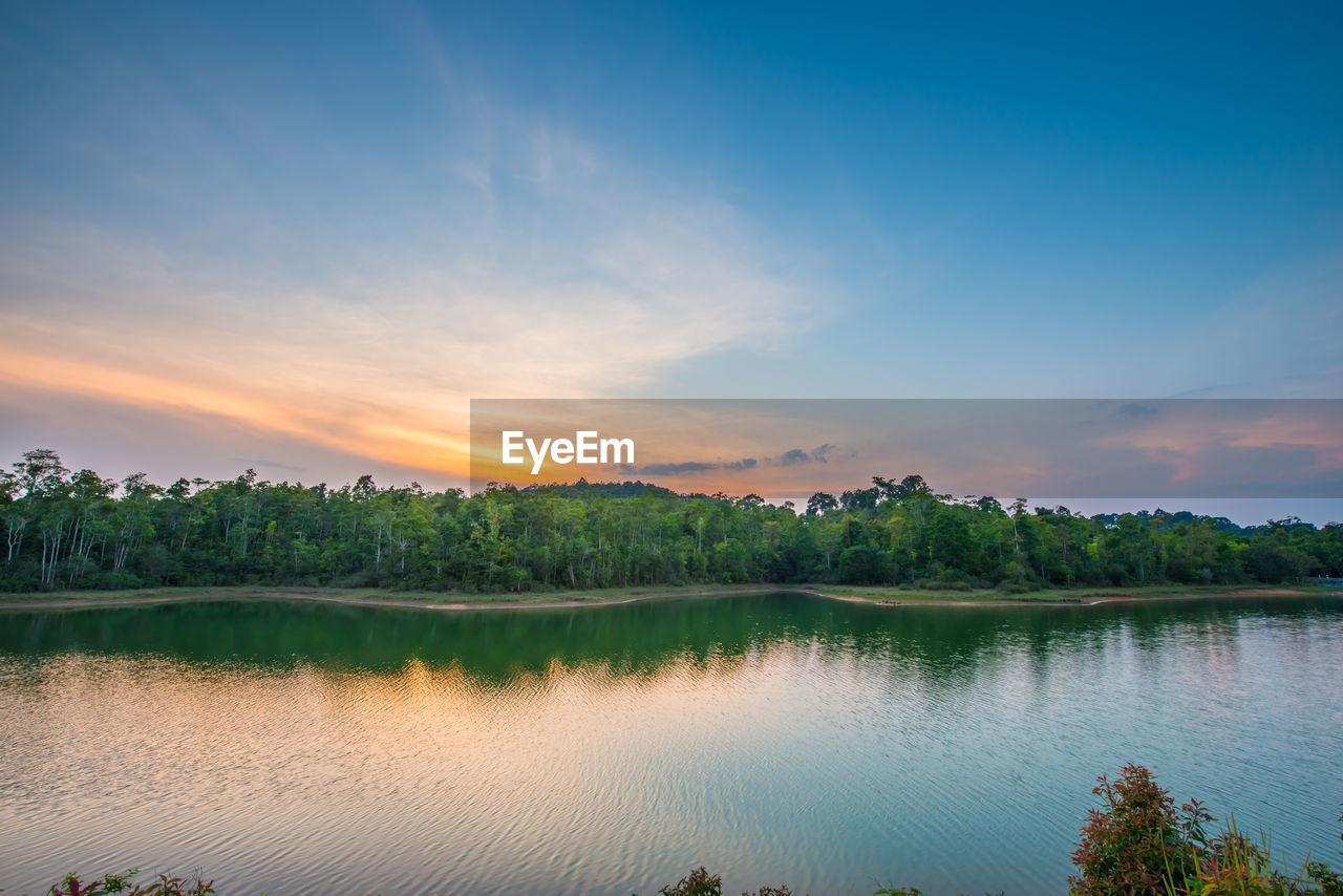 Scenic view of lake against sky during sunset