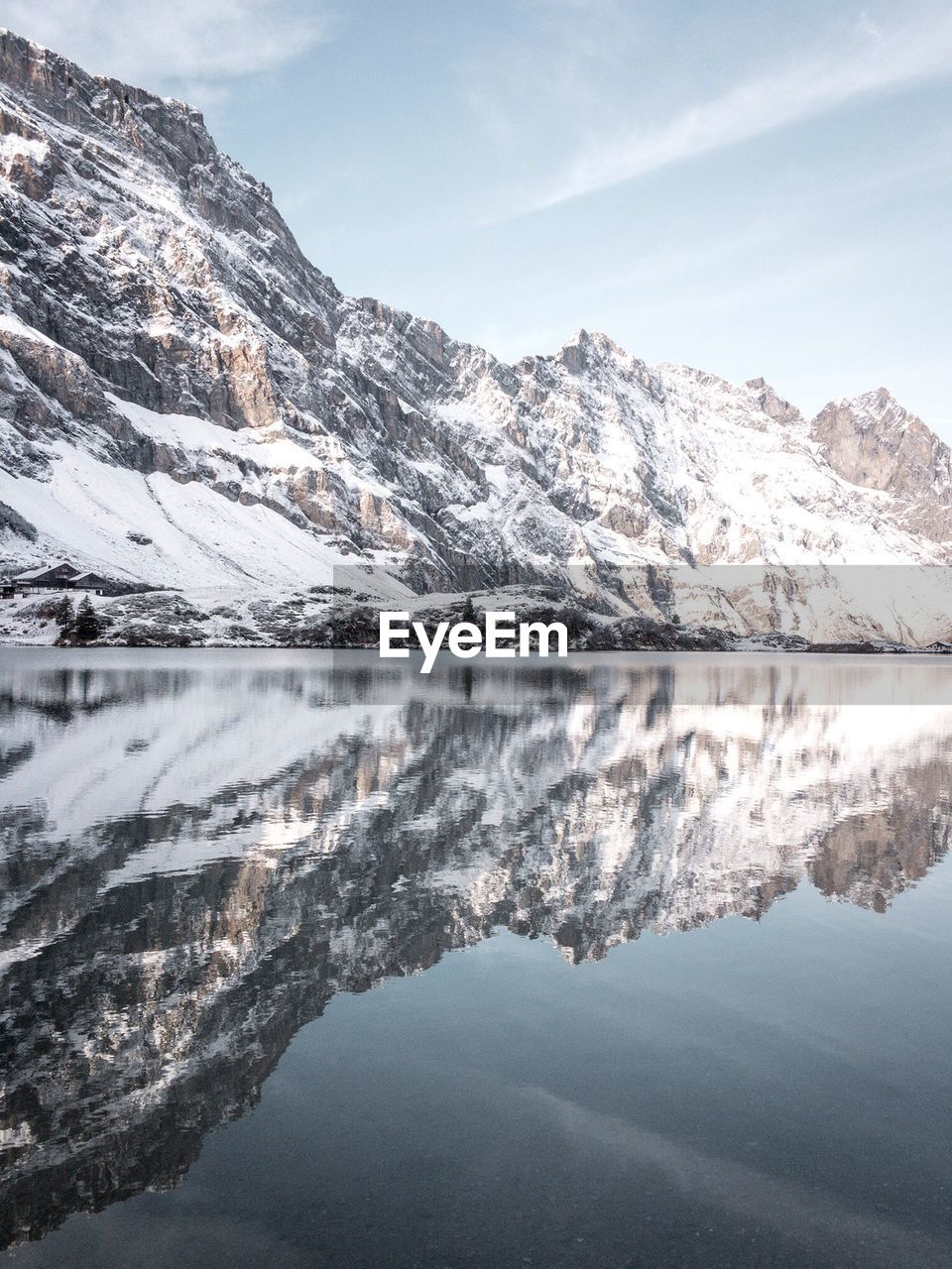 Scenic view of snowcapped mountains and lake against sky
