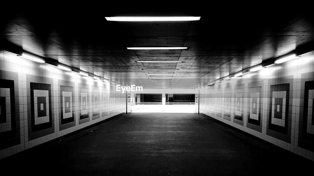 Illuminated empty subway tunnel