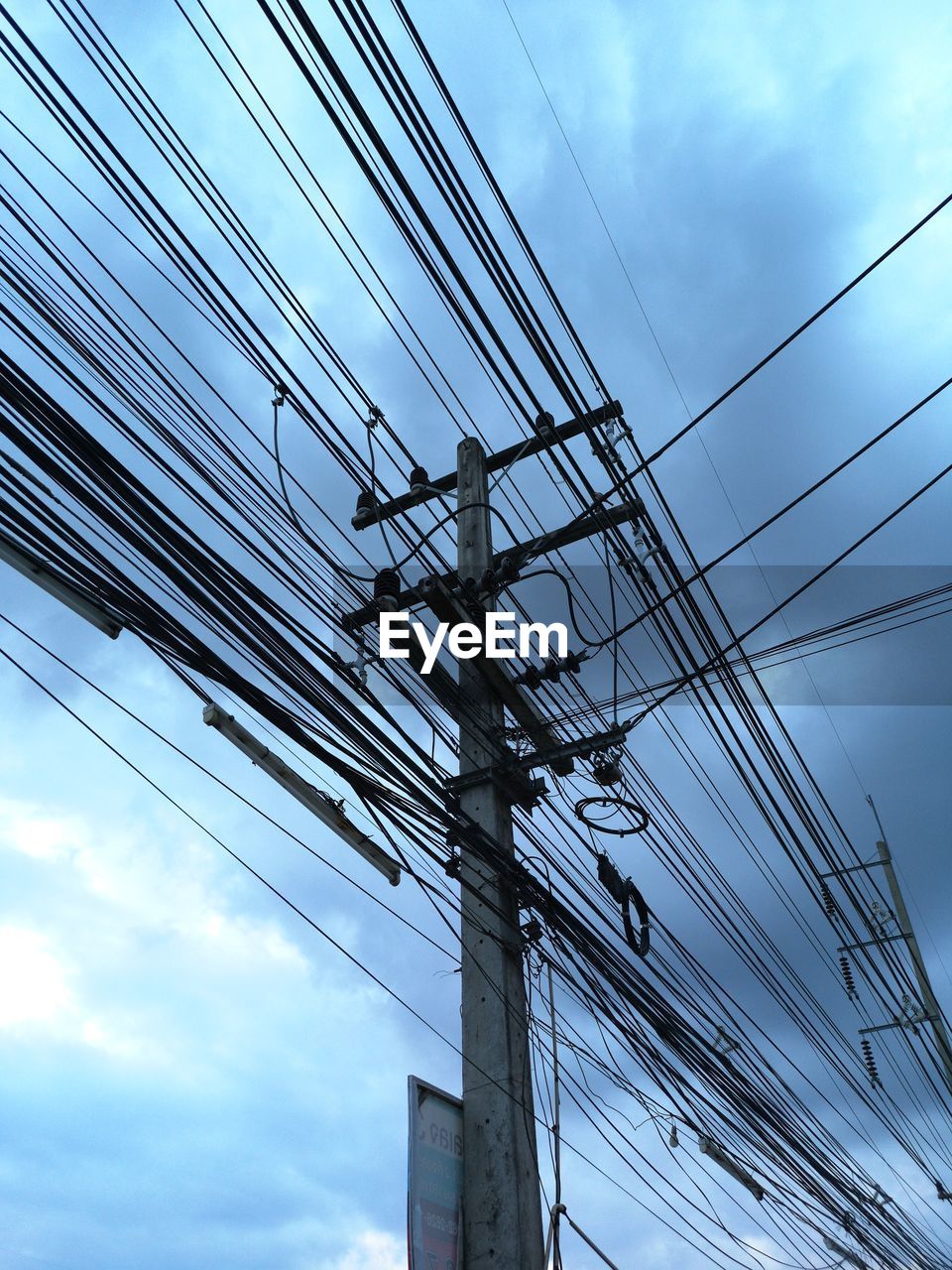 Low angle view of electricity pylon against sky