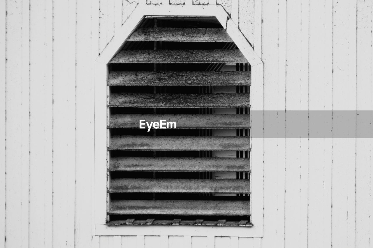 Glass shutters of covered bridge window