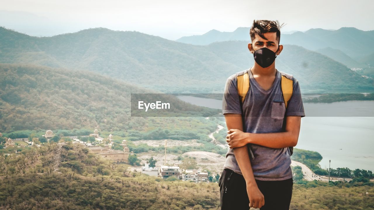 Young man looking at mountains