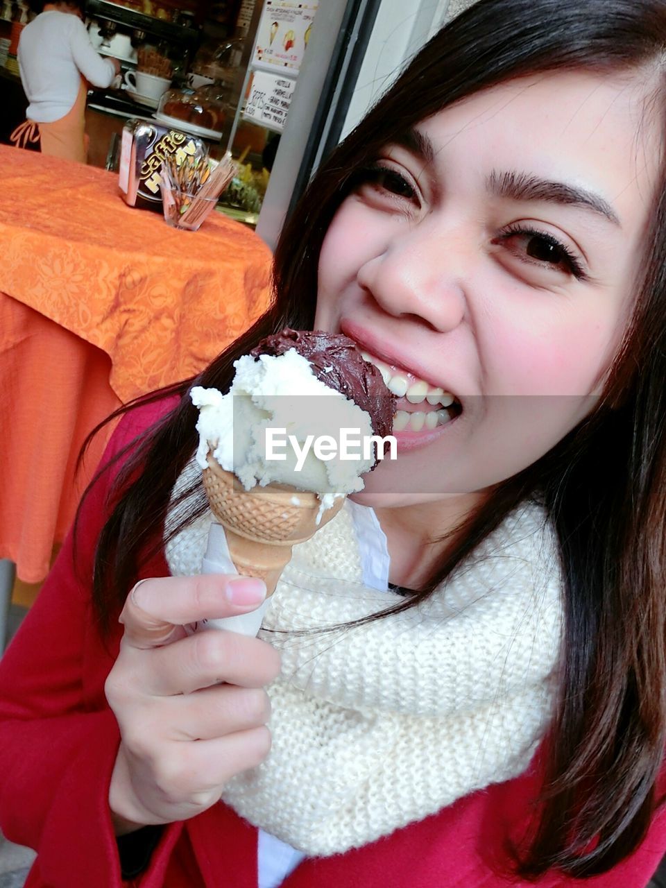 PORTRAIT OF GIRL HOLDING ICE CREAM