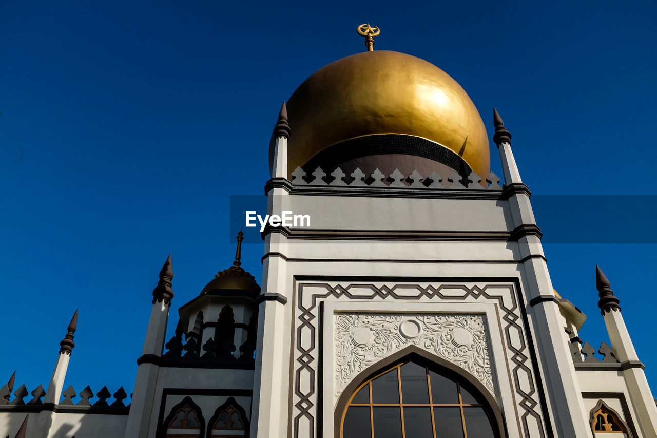 Low angle view of cathedral against clear blue sky