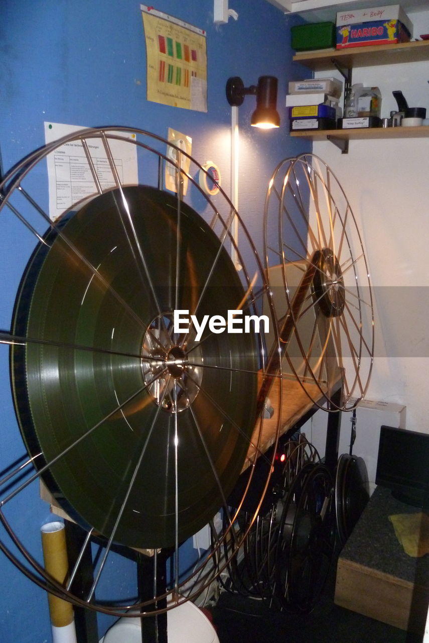 LOW ANGLE VIEW OF ILLUMINATED CLOCK IN THEATER