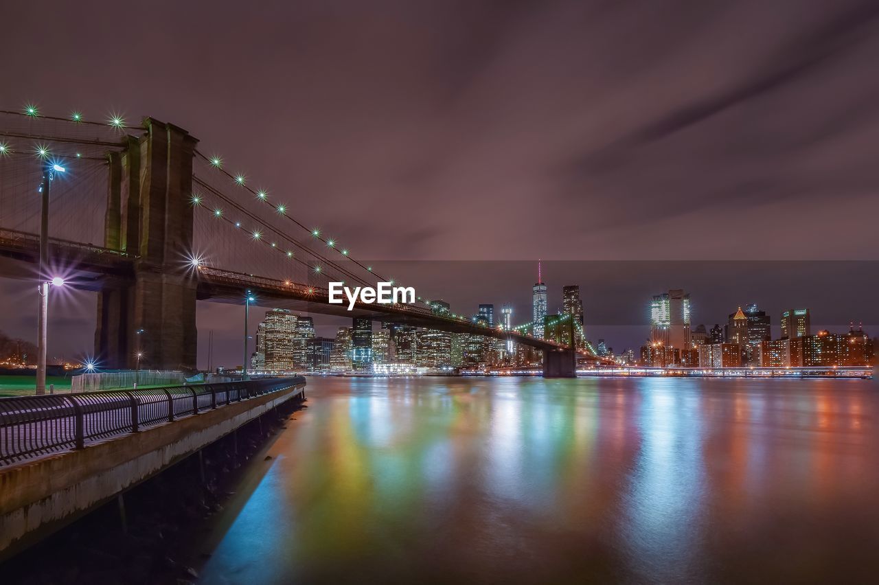 Brooklyn bridge over east river at manhattan at night