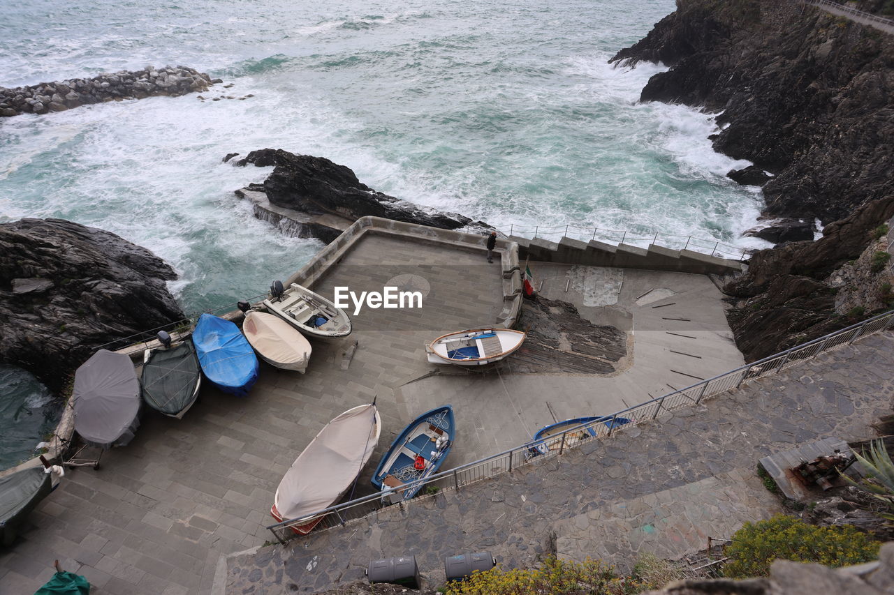 High angle view of boats on sea shore