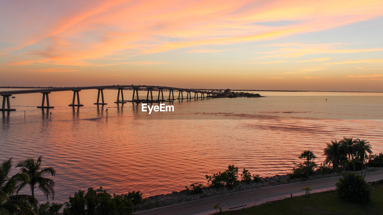 Scenic view of sea against orange sky