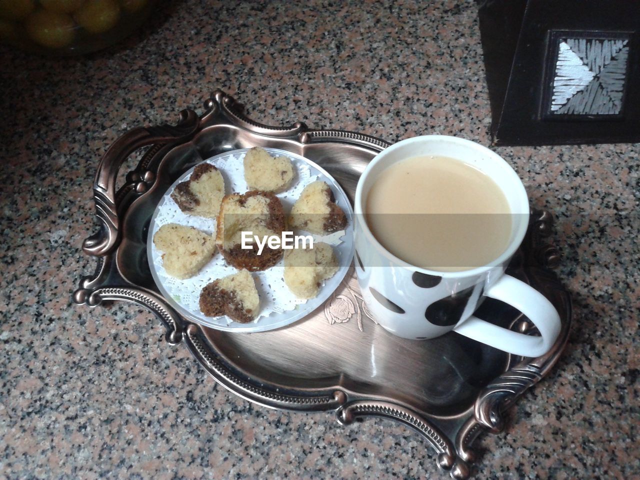 CLOSE-UP OF TEA CUPS ON TABLE