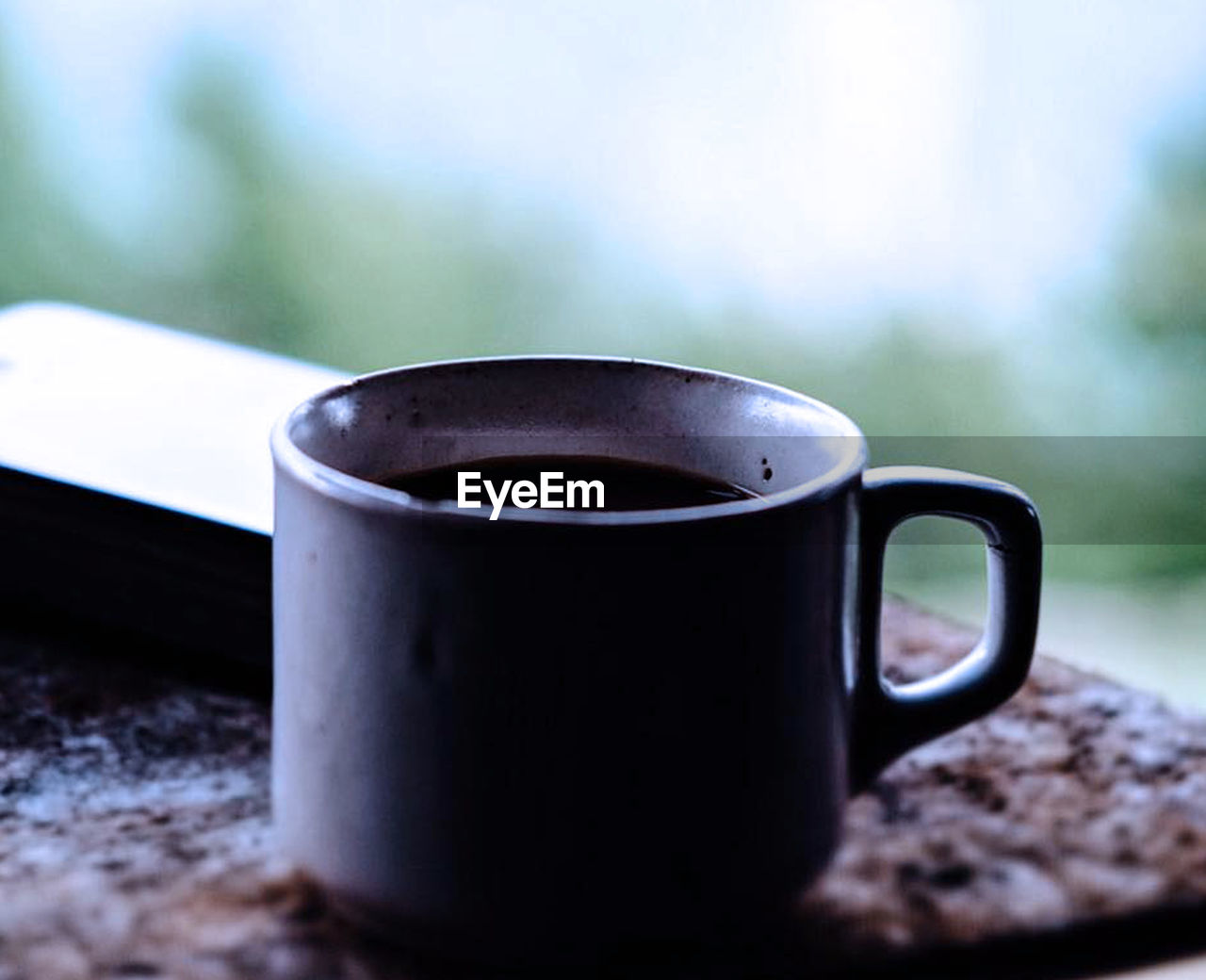 Close-up of coffee cup on table