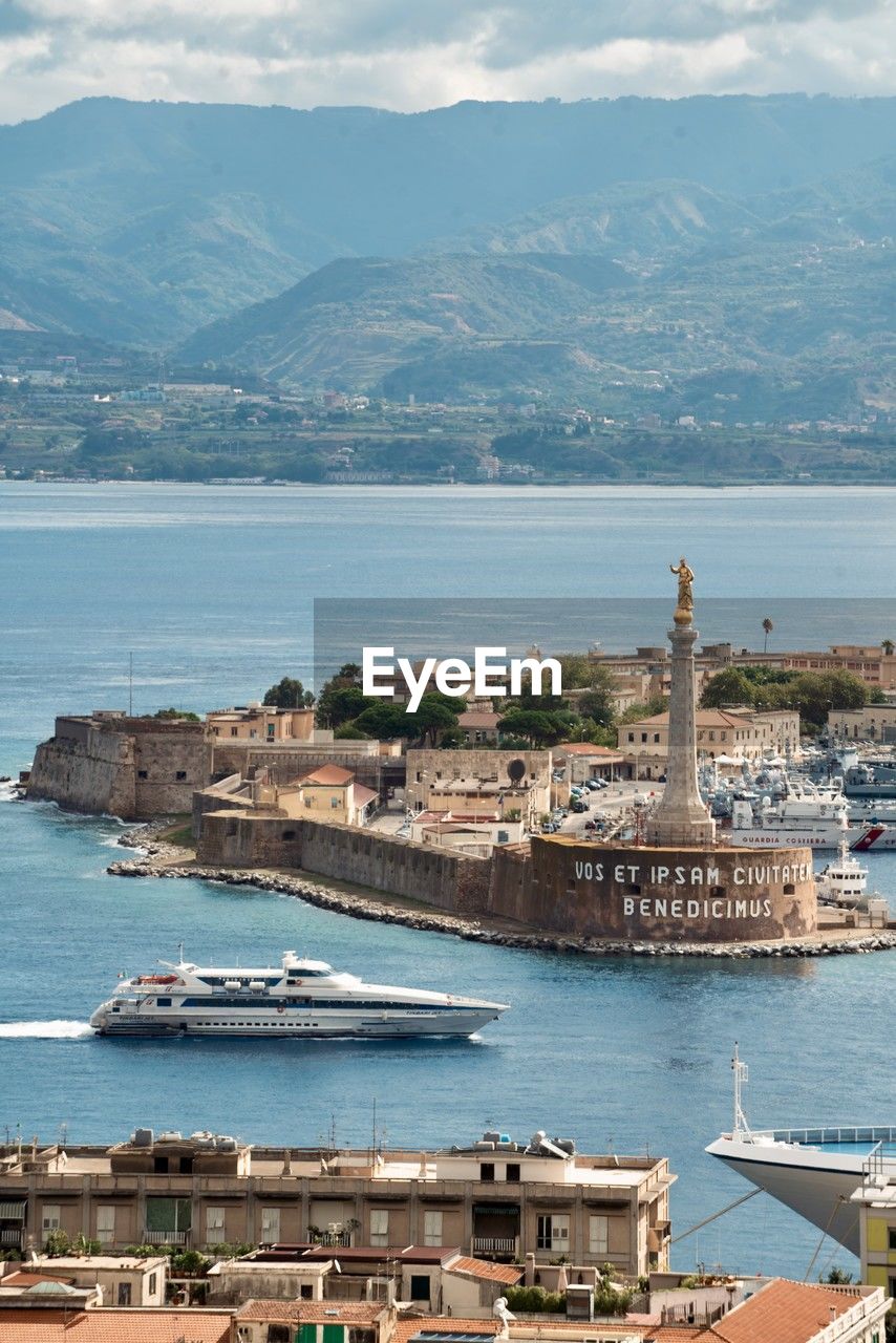 high angle view of townscape by sea