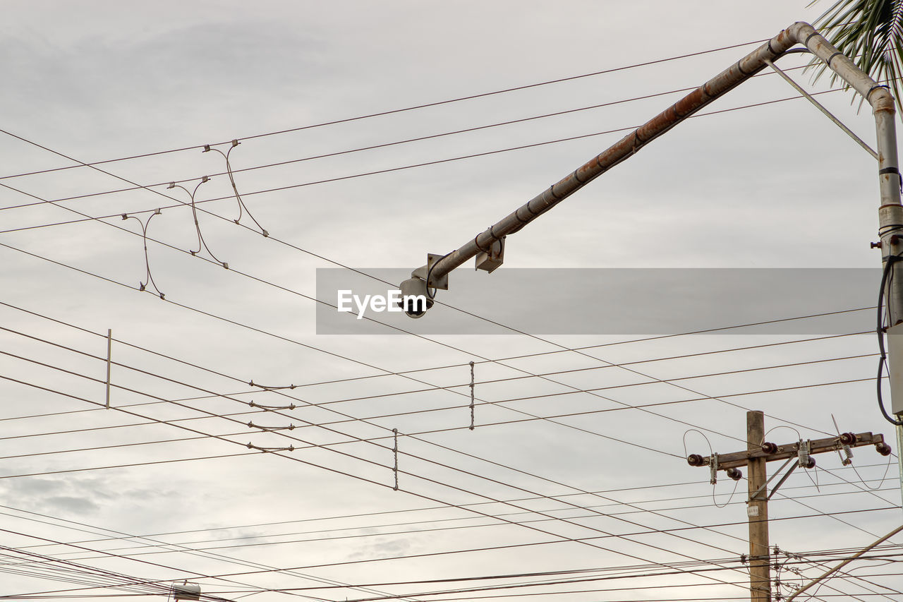 LOW ANGLE VIEW OF POWER LINES AGAINST SKY