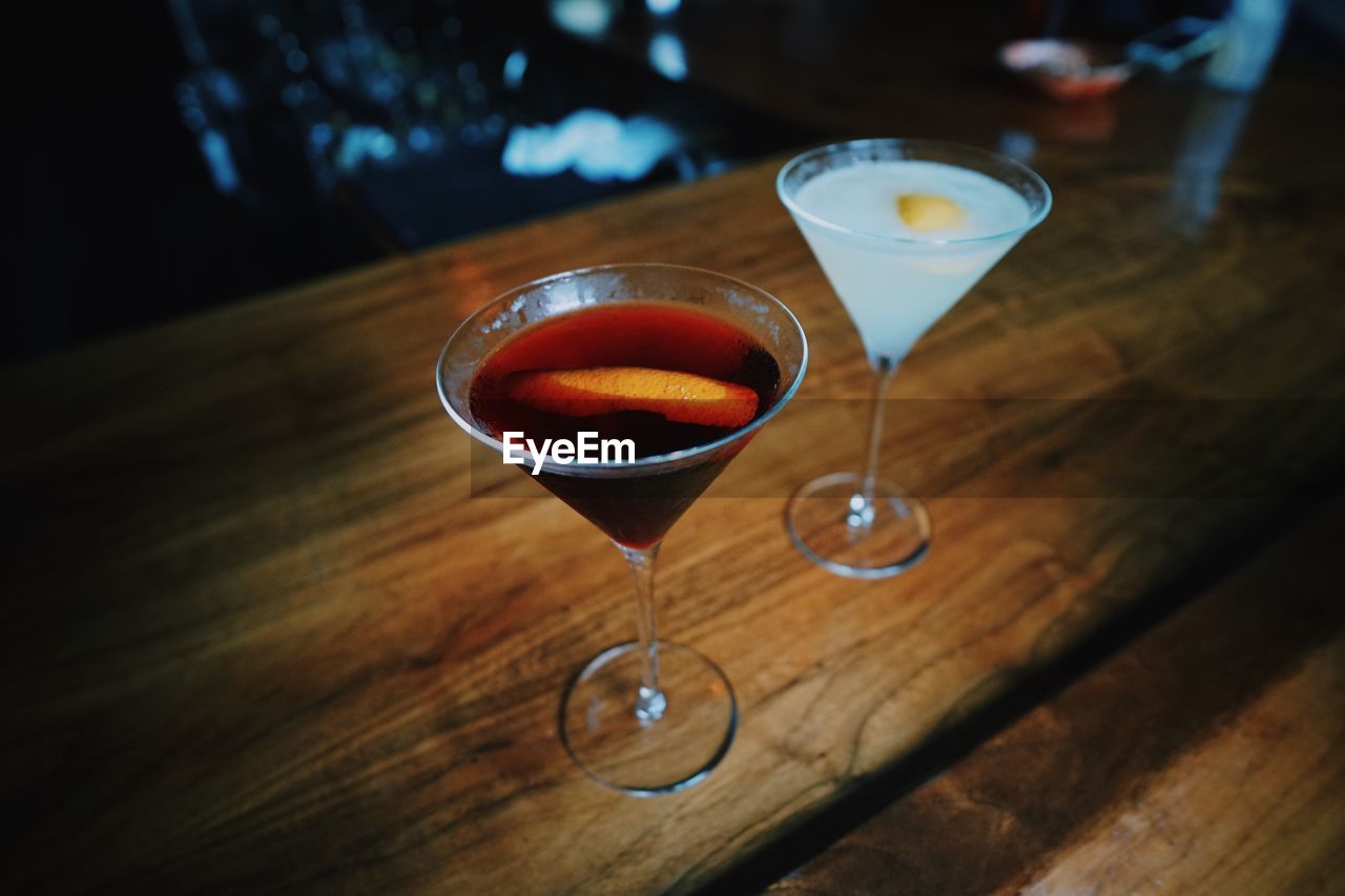 Close-up of drink in martini glass on table