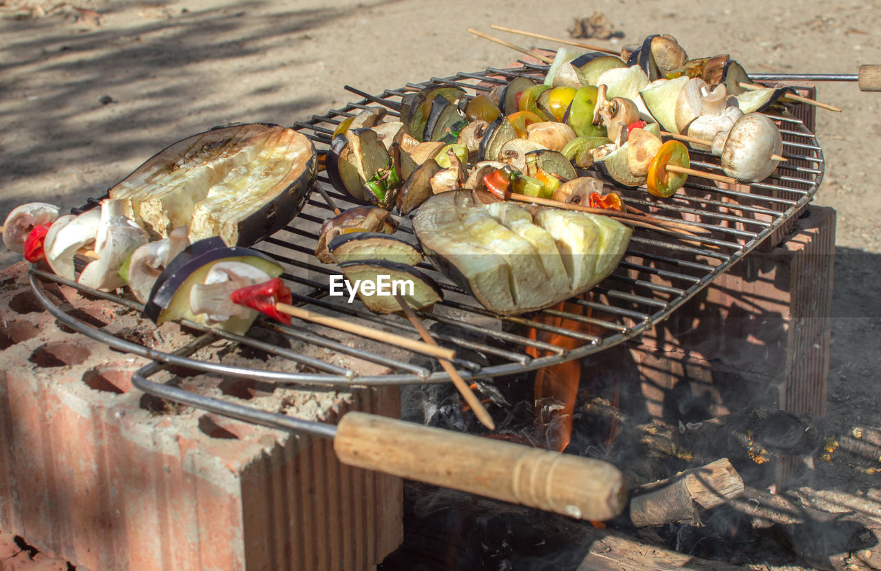 HIGH ANGLE VIEW OF VEGETABLES ON BARBECUE