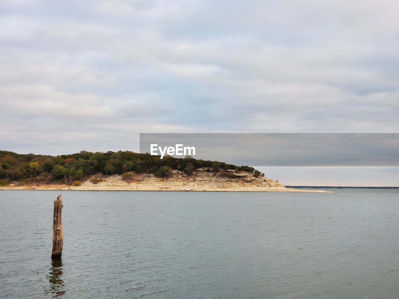 water, sky, sea, land, cloud, shore, scenics - nature, body of water, beauty in nature, tranquility, nature, beach, tranquil scene, ocean, no people, day, coast, outdoors, environment, idyllic, non-urban scene, reflection, horizon, travel destinations, bay, landscape, island, coastline, travel