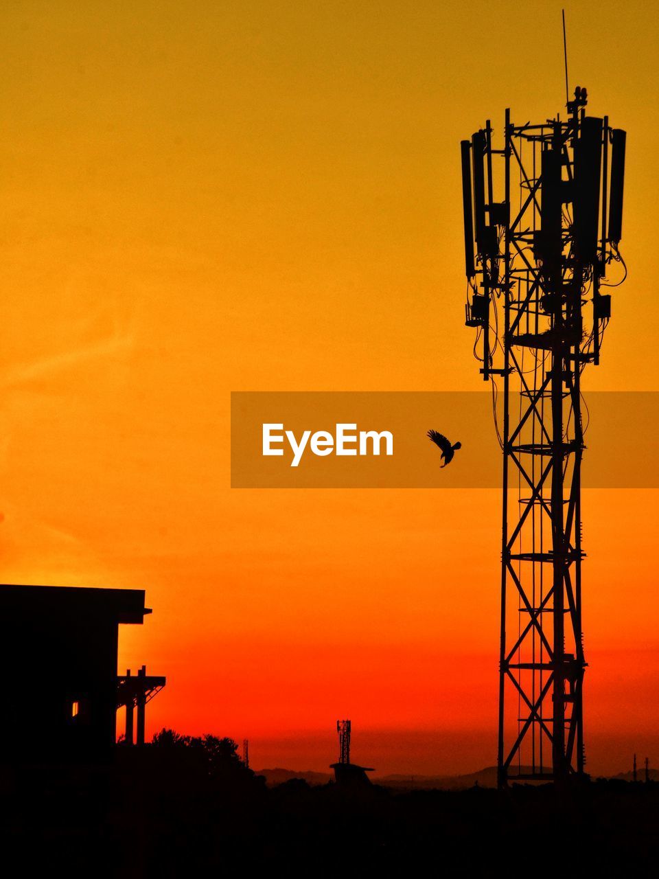 SILHOUETTE OF ELECTRICITY PYLON DURING SUNSET