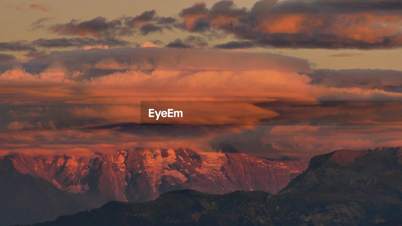 Scenic view of mountains against sky during sunset