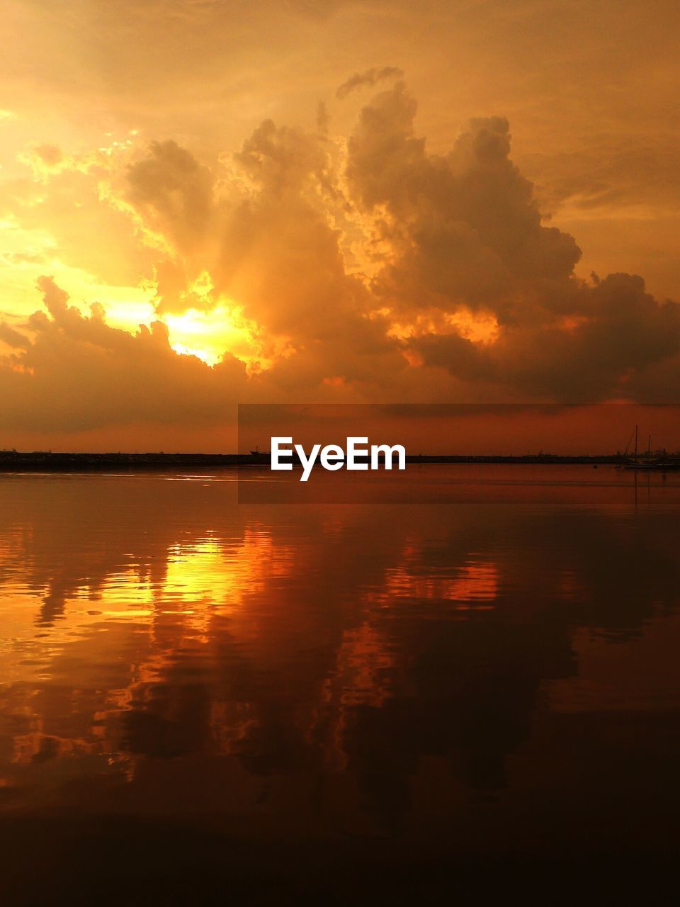View of calm sea at sunset