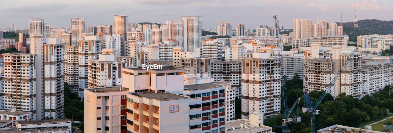 High angle view of buildings in city against sky